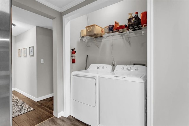 4481 Mclain Cir, Acworth, GA 30101 - clothes washing area featuring wood finished floors, baseboards, laundry area, separate washer and dryer, and ornamental molding