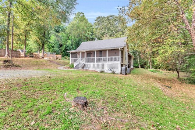4481 Mclain Cir, Acworth, GA 30101 - view of front of property with a front yard and a sunroom