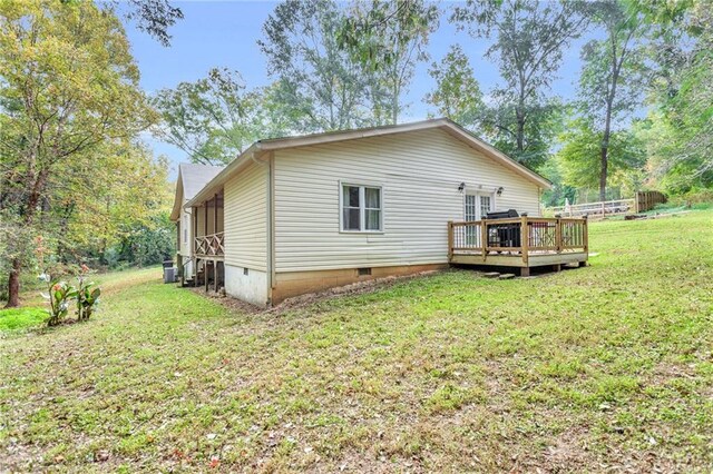 4481 Mclain Cir, Acworth, GA 30101 - rear view of house with a deck, a yard, and crawl space