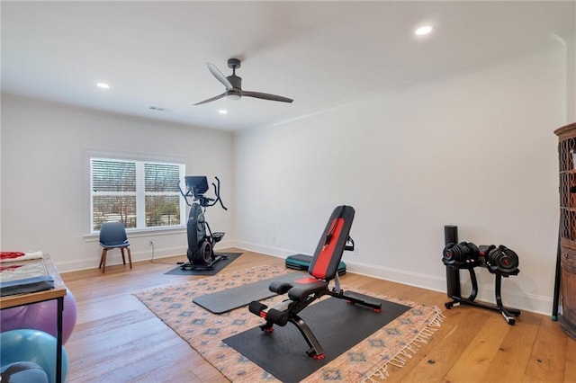 workout area featuring recessed lighting, baseboards, light wood-style floors, and ceiling fan
