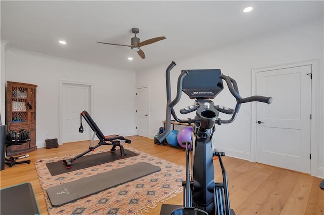 exercise area featuring light wood-style flooring, recessed lighting, baseboards, and ceiling fan