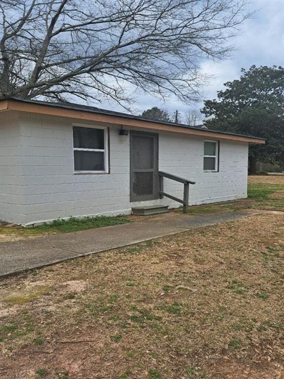 exterior space with concrete block siding