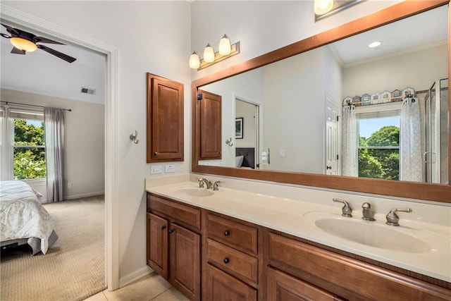 11271 Calypso Dr, Alpharetta, GA 30009 - ensuite bathroom with plenty of natural light, double vanity, a ceiling fan, tile patterned flooring, and crown molding