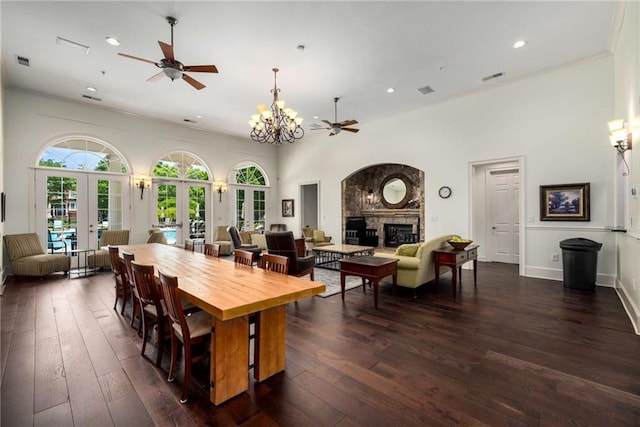 11271 Calypso Dr, Alpharetta, GA 30009 - dining room with ceiling fan, a glass covered fireplace, french doors, recessed lighting, and dark wood-style floors