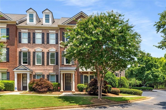 11271 Calypso Dr, Alpharetta, GA 30009 - view of property with brick siding and a front yard