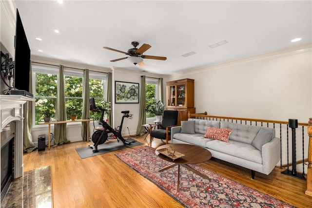 11271 Calypso Dr, Alpharetta, GA 30009 - living area featuring ceiling fan, a premium fireplace, ornamental molding, wood finished floors, and recessed lighting