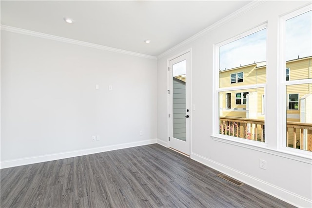 unfurnished room with recessed lighting, dark wood-type flooring, visible vents, baseboards, and ornamental molding