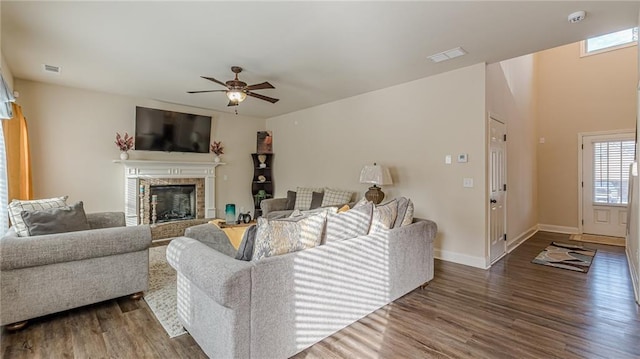 879 Tranquil Way, Hampton, GA 30228 - living room featuring wood finished floors, a ceiling fan, and a fireplace