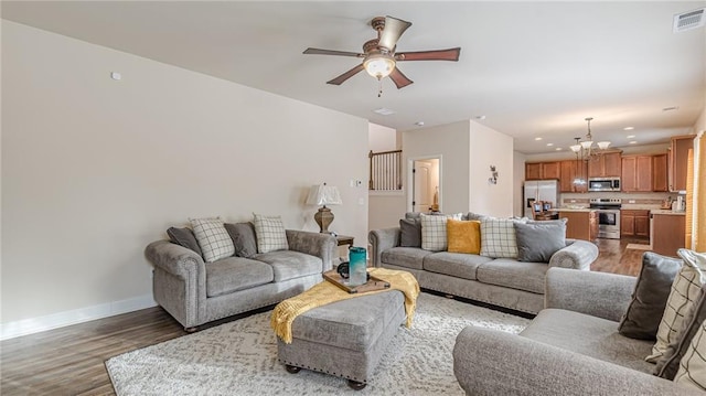 879 Tranquil Way, Hampton, GA 30228 - living area featuring light wood-type flooring, ceiling fan, a chandelier, and recessed lighting
