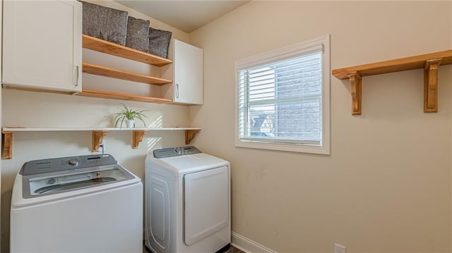 879 Tranquil Way, Hampton, GA 30228 - laundry room with washing machine and clothes dryer and cabinet space