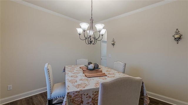 879 Tranquil Way, Hampton, GA 30228 - dining space with a chandelier, dark wood finished floors, and crown molding