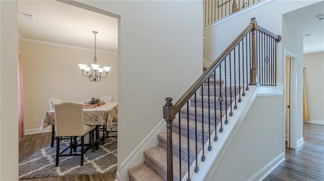 879 Tranquil Way, Hampton, GA 30228 - stairway with wood finished floors, a chandelier, and ornamental molding