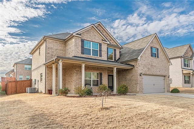 879 Tranquil Way, Hampton, GA 30228 - craftsman inspired home featuring a garage, brick siding, driveway, and a porch