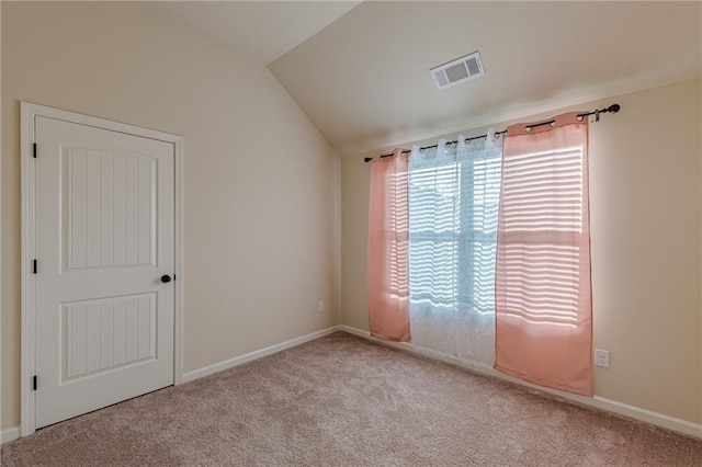 879 Tranquil Way, Hampton, GA 30228 - carpeted spare room featuring lofted ceiling and baseboards