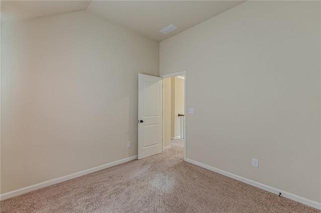 879 Tranquil Way, Hampton, GA 30228 - carpeted empty room with vaulted ceiling and baseboards