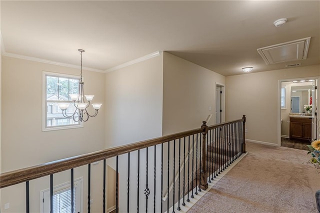 879 Tranquil Way, Hampton, GA 30228 - corridor with attic access, carpet, a chandelier, crown molding, and an upstairs landing