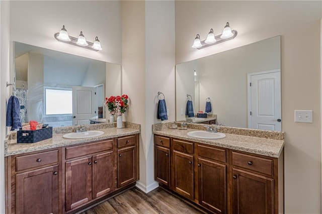 879 Tranquil Way, Hampton, GA 30228 - full bath with two vanities and wood finished floors