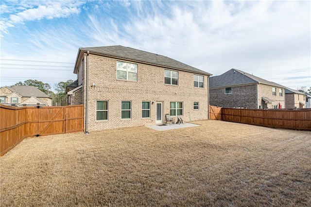 879 Tranquil Way, Hampton, GA 30228 - rear view of house with a patio area, a fenced backyard, and brick siding