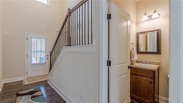 879 Tranquil Way, Hampton, GA 30228 - entryway featuring dark wood finished floors and stairs