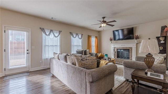 879 Tranquil Way, Hampton, GA 30228 - living area featuring a fireplace, ceiling fan, and wood finished floors