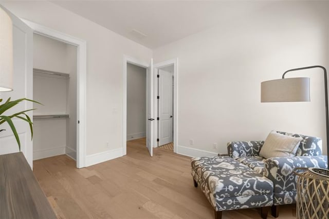 sitting room featuring light hardwood / wood-style floors