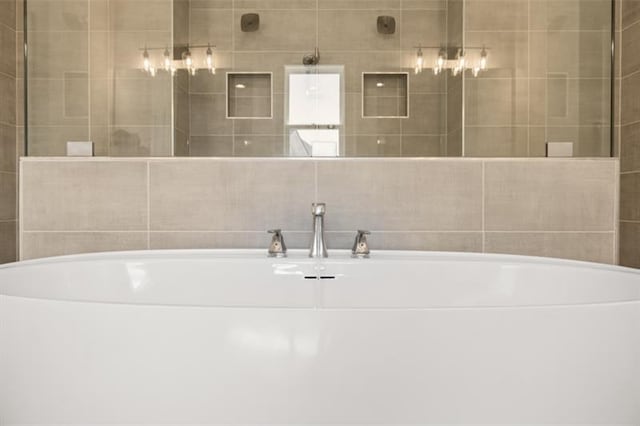 bathroom featuring a tub to relax in