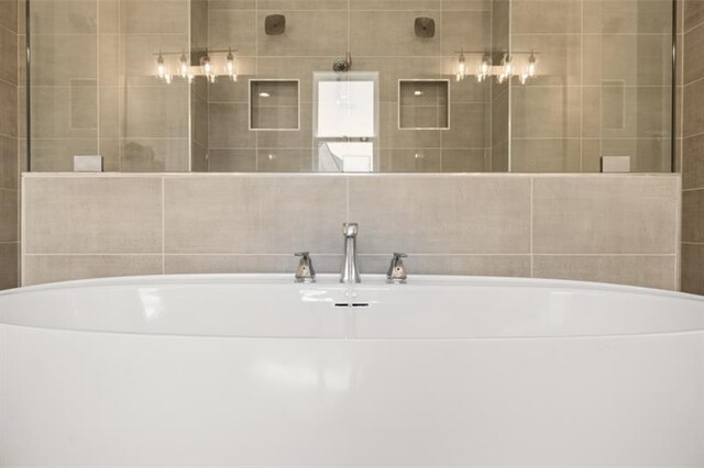 bathroom featuring a tile shower