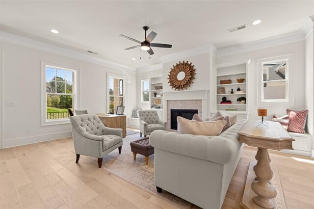 living room featuring light hardwood / wood-style flooring and ceiling fan