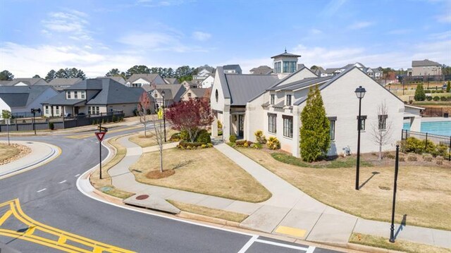 surrounding community with volleyball court and a playground