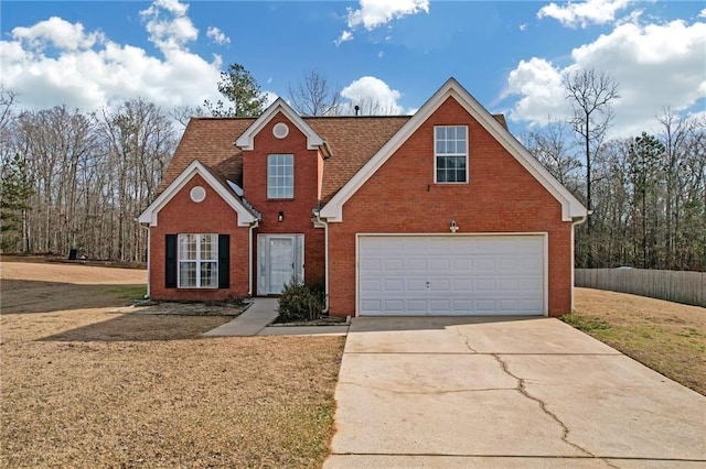 view of property with a front lawn and a garage