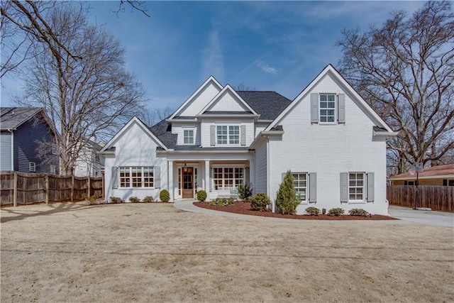 view of front of home with a front yard and a porch