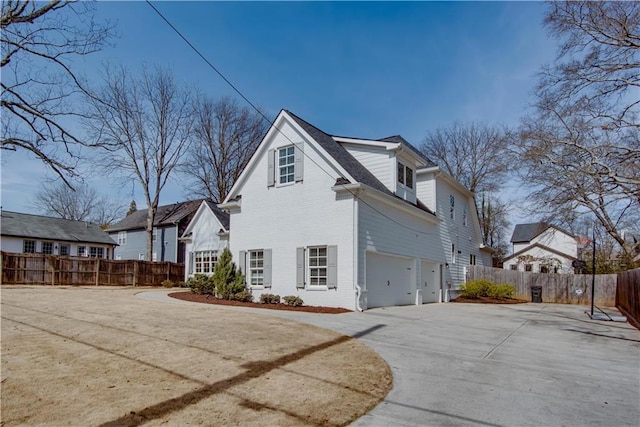 view of side of home with a garage