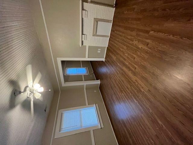 empty room with dark hardwood / wood-style floors