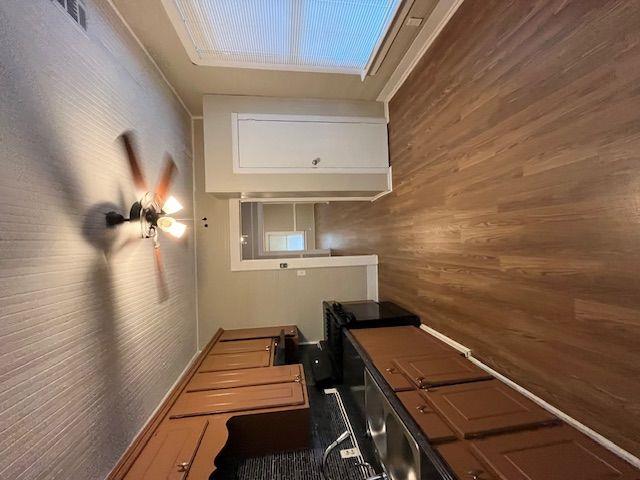 kitchen with wooden walls