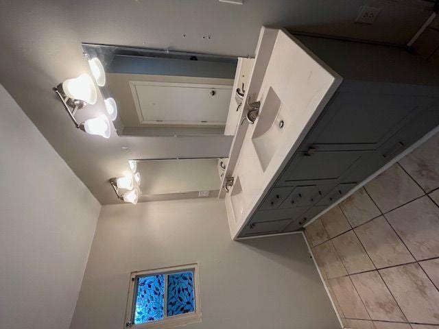 bathroom with tile patterned floors