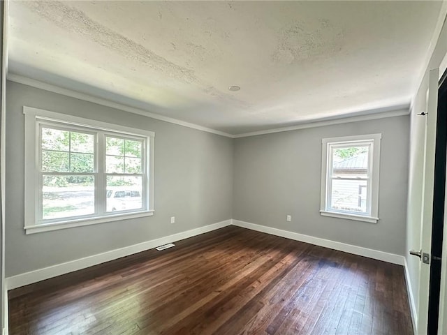 6538 N Sweetwater Rd, Lithia Springs, GA 30122 - spare room with dark wood-style floors, baseboards, crown molding, and a textured ceiling