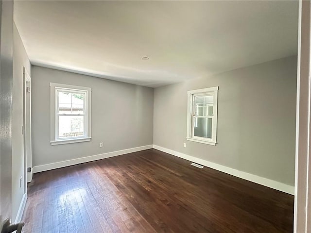 6538 N Sweetwater Rd, Lithia Springs, GA 30122 - spare room with dark wood finished floors and baseboards