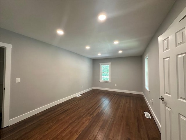 6538 N Sweetwater Rd, Lithia Springs, GA 30122 - spare room featuring dark wood finished floors, baseboards, and recessed lighting