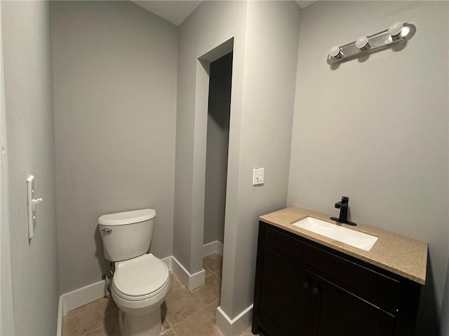 6538 N Sweetwater Rd, Lithia Springs, GA 30122 - bathroom with vanity, toilet, baseboards, and tile patterned flooring