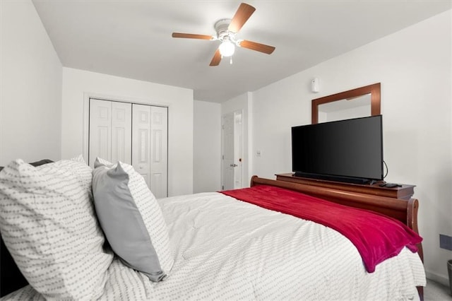 bedroom featuring ceiling fan and a closet