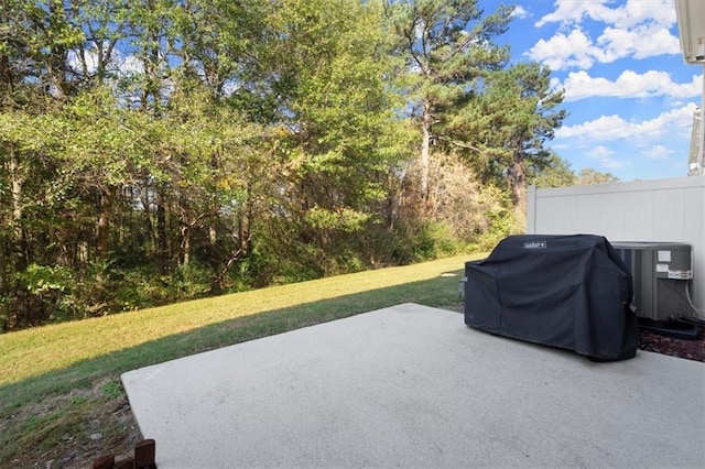 view of patio with central air condition unit and a grill