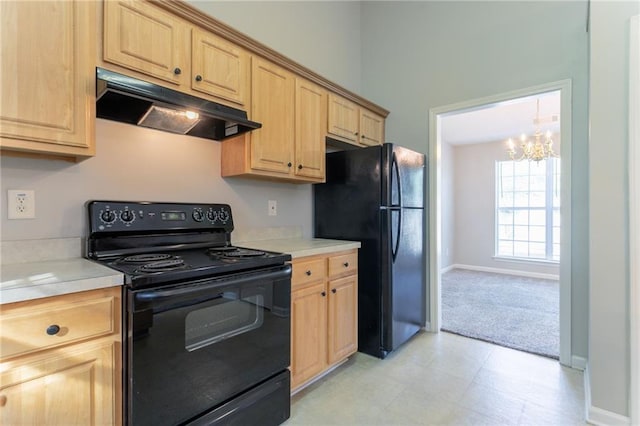 5033 Kens Ct, Stockbridge, GA 30281 - kitchen featuring black appliances, under cabinet range hood, light brown cabinetry, a chandelier, and light countertops