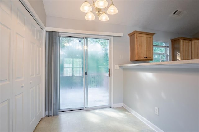 5033 Kens Ct, Stockbridge, GA 30281 - unfurnished dining area with a chandelier and baseboards
