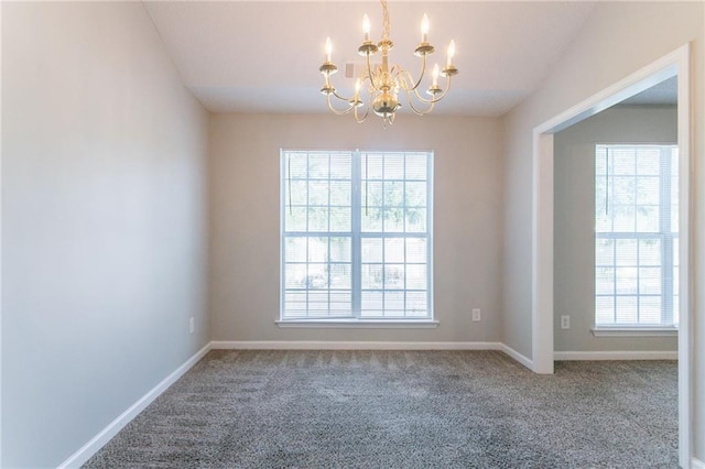 5033 Kens Ct, Stockbridge, GA 30281 - carpeted spare room featuring a chandelier and baseboards