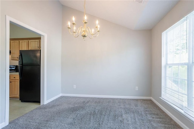 5033 Kens Ct, Stockbridge, GA 30281 - unfurnished dining area featuring lofted ceiling, a chandelier, and light colored carpet
