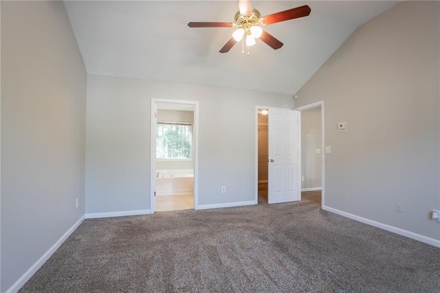 5033 Kens Ct, Stockbridge, GA 30281 - unfurnished bedroom with lofted ceiling, a spacious closet, carpet, connected bathroom, and ceiling fan