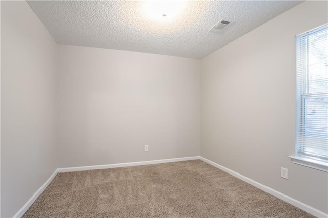 5033 Kens Ct, Stockbridge, GA 30281 - empty room featuring carpet flooring and a textured ceiling