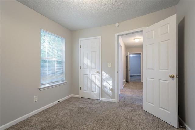 5033 Kens Ct, Stockbridge, GA 30281 - unfurnished bedroom featuring carpet flooring and a textured ceiling