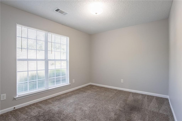 5033 Kens Ct, Stockbridge, GA 30281 - carpeted empty room with baseboards and a textured ceiling
