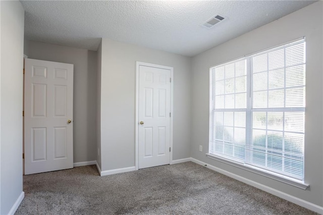 5033 Kens Ct, Stockbridge, GA 30281 - unfurnished bedroom with carpet and a textured ceiling
